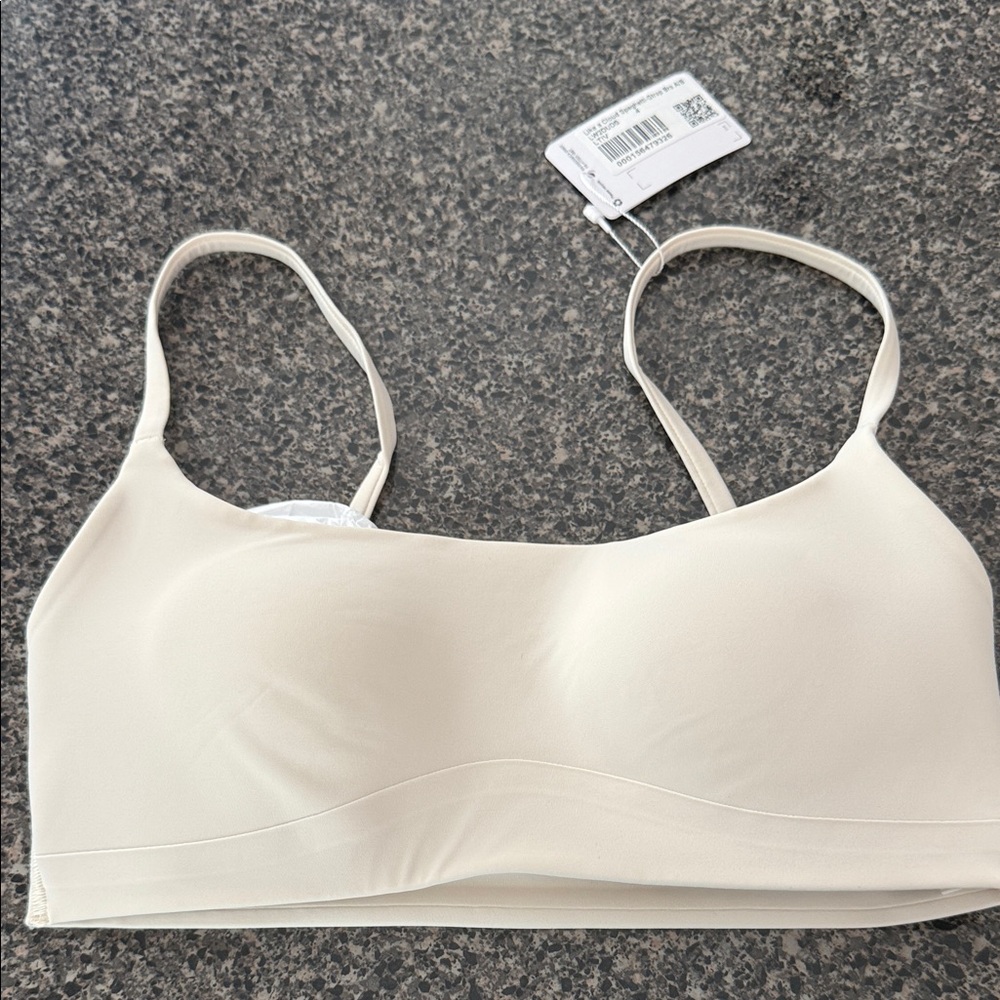 Like a cloud brand new spaghetti strap A/B size 4.  Brand new with tags